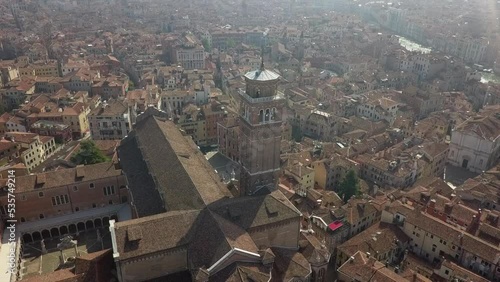 Christian basilica tower: Aerial ascends above city of Venice, Italy photo