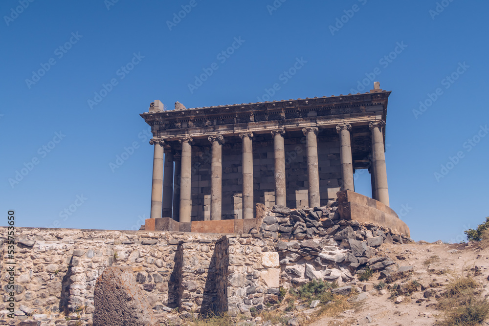 Temple of Garni in Armenia picturesque photo with the blue sky in the background and no people around. Ruins of ancient Armenian temple. Armenia landscape attraction.