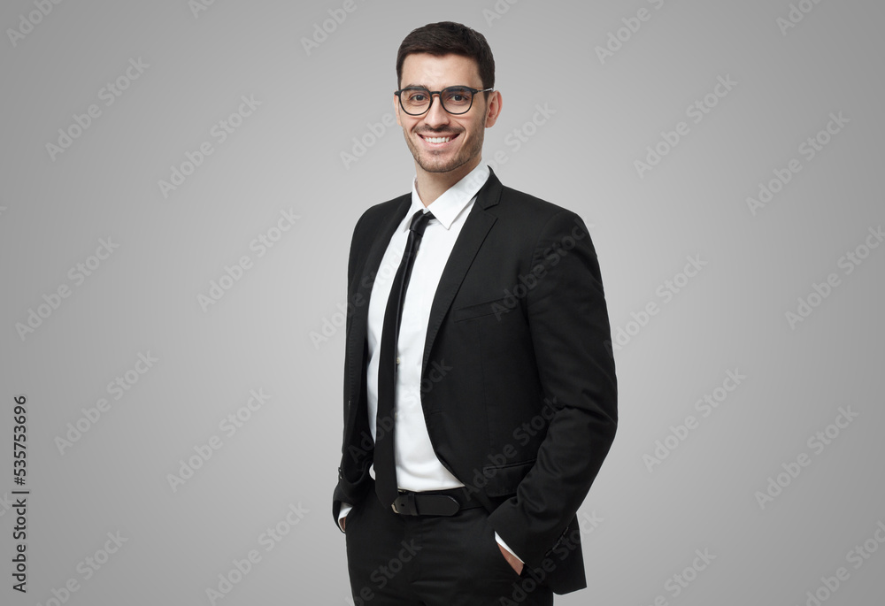Business man in glasses looking at camera, showing confidence and providing stability for employees Business man in glasses looking at camera, showing confidence and providing stability for employees