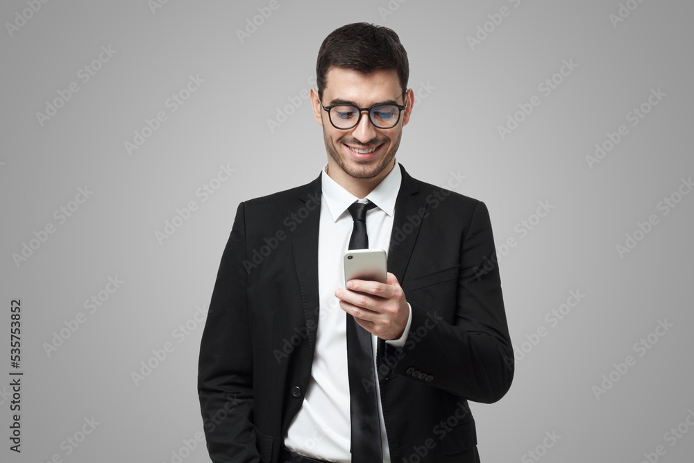 Young ceo, chief officer takes a look at financial report via phone app online Young ceo, chief officer takes a look at financial report via phone app online