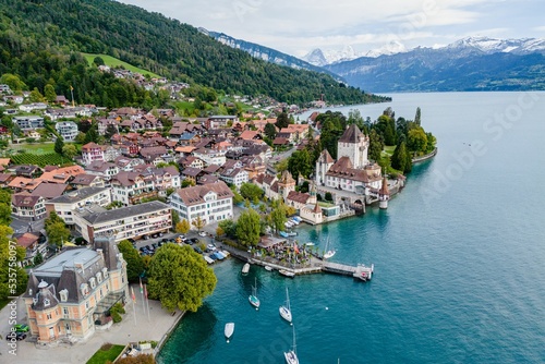 Aerial view of the Oberhofen Castle and the coastal city in Switzerland photo