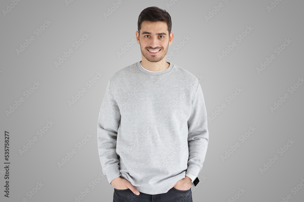 Daylight portrait of smiling handsome man isolated on gray background Daylight portrait of smiling handsome man isolated on gray background