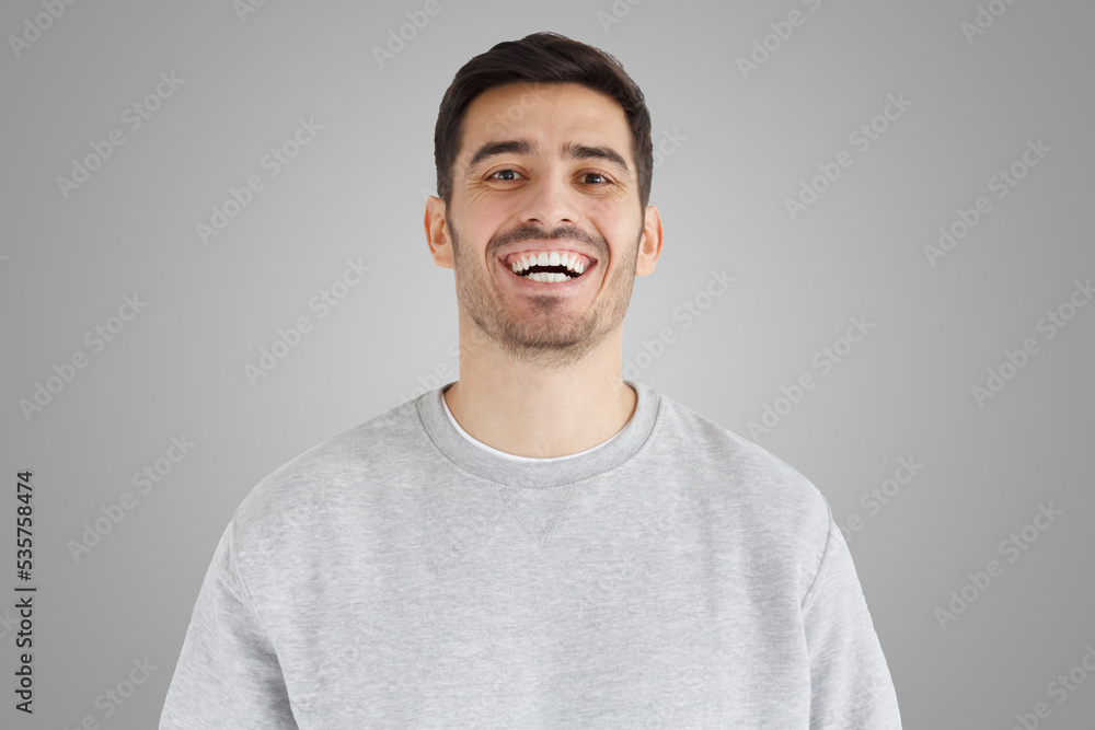 Young man in smiles broadly, laughing, showing perfect white teeth Young man in smiles broadly, laughing, showing perfect white teeth