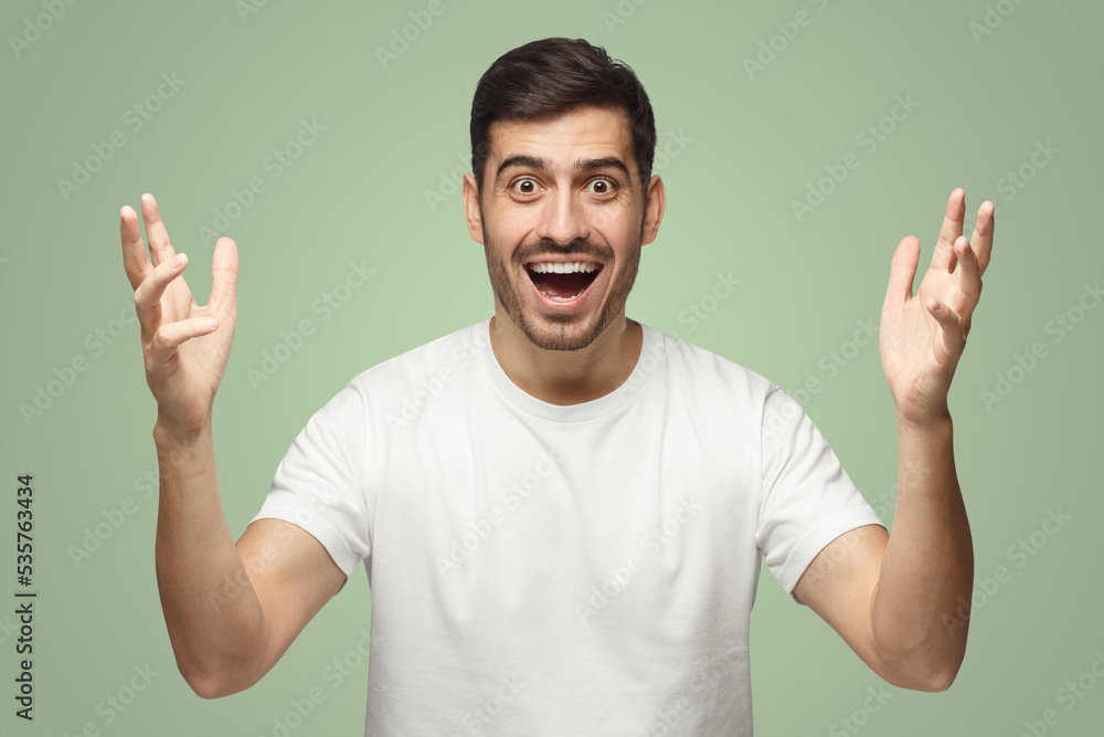 Happy crazy man showing big size gesture with hands, emphasizing great amount of something Happy crazy man showing big size gesture with hands, emphasizing great amount of something