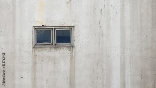 Small window on concrete wall.