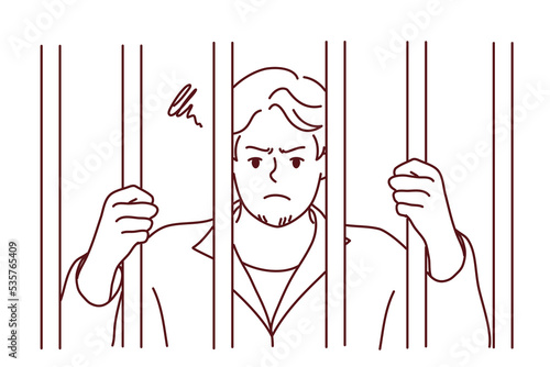 Unhappy man in robe behind bars in jail. Angry male criminal imprisoned for crime or misdemeanor. Imprisonment and sentence. Vector illustration. 