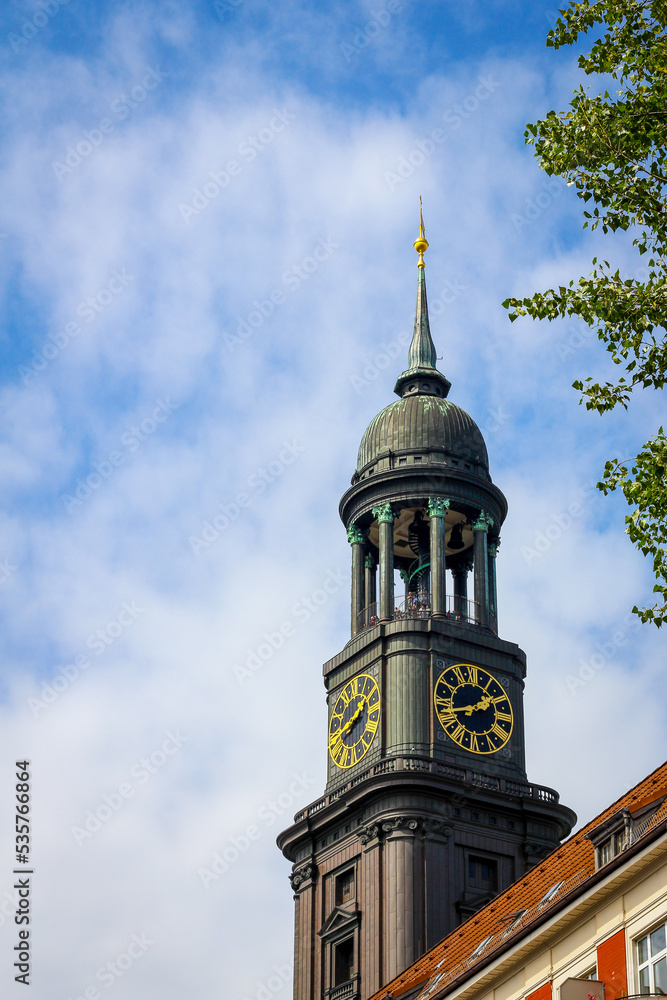The tower of St Michaels church (Hauptkirche Sankt Michaelis) with people on the viewing platform on a bright summer day with blue sky