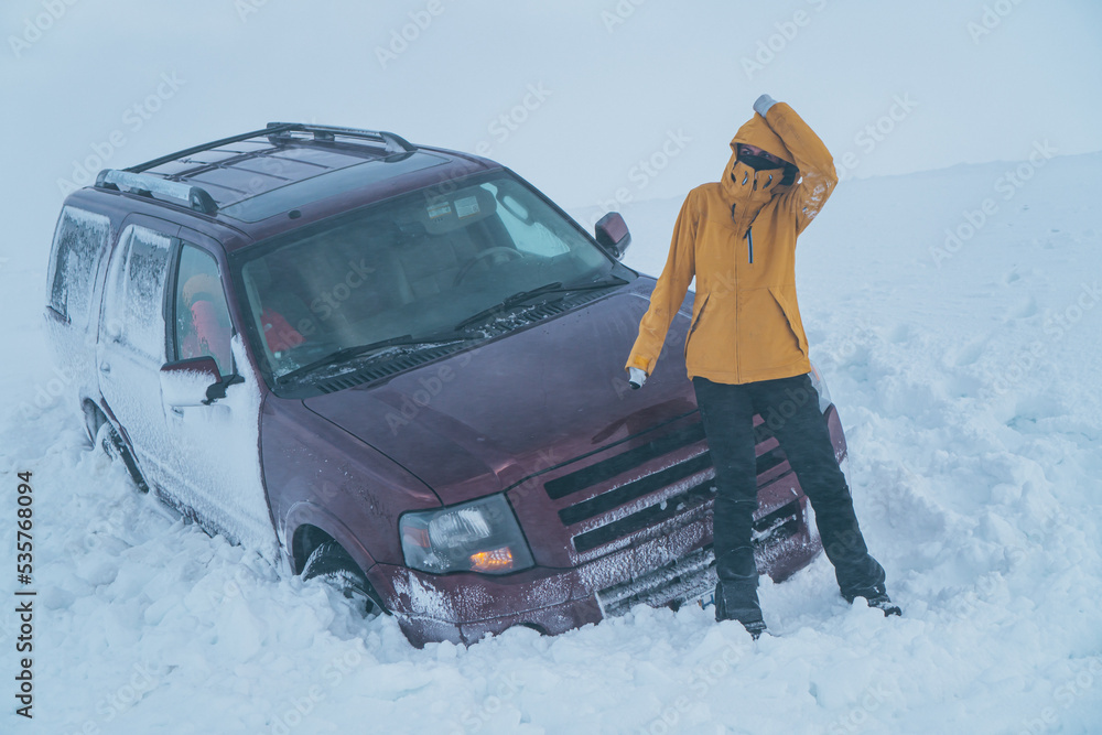 Woman suffered an accident in the snow with her car in the middle of a freezing storm.