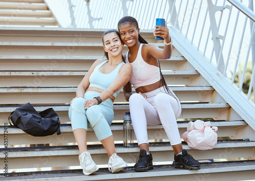 Fitness, phone and friends take selfie after running, exercise and workout for social media outdoors on steps or stairs. Diversity, wellness and happy runners showing women or girls power in sports