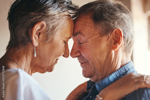 Love, support and elderly couple hug, commitment and understanding in their home together. Wellness, intimate and romantic seniors enjoy soulmate connection while bonding with affection and romance