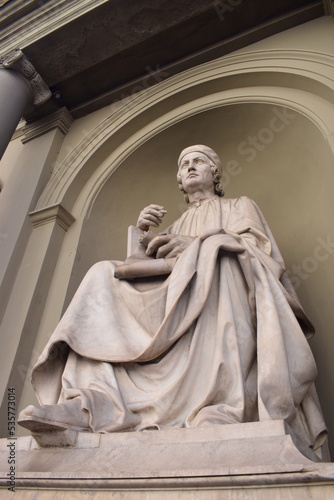 Statue of the Cardinal Arnolfo di Cambio in Florence, Italy photo