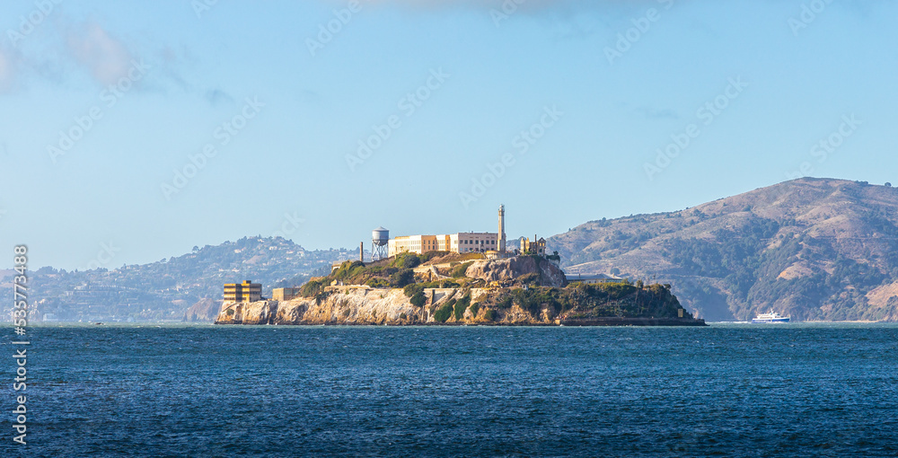 Alcatraz island over horizon of water surface, San Francisco.