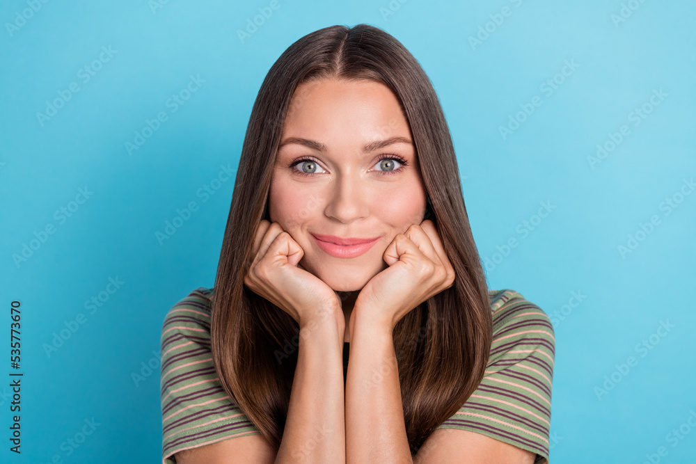Closeup photo of young pretty nice woman wear striped khaki t-shirt cute clean face touch cheekbones positive smile beauty isolated on blue color background Closeup photo of young pretty nice woman wear striped khaki t-shirt cute clean face touch cheekbones positive smile beauty isolated on blue color background