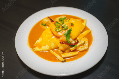 Japanese Cuisine, Shrimp Curry Rice Wrapped with Omelette photo