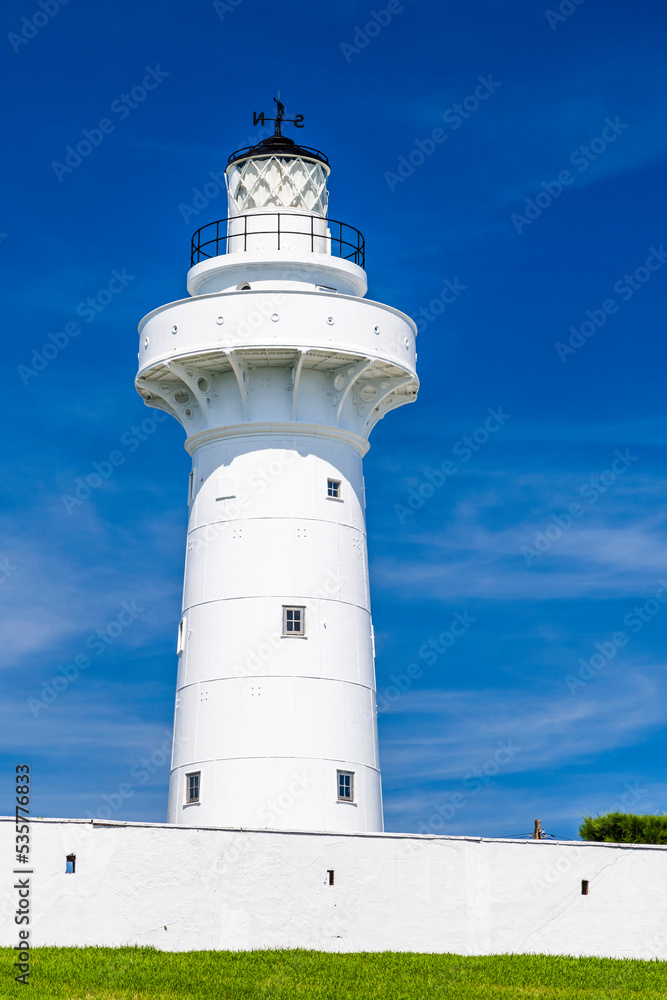 Close-up of white Eluanbi Lighthouse with the blue sky background Close-up of white Eluanbi Lighthouse with the blue sky background