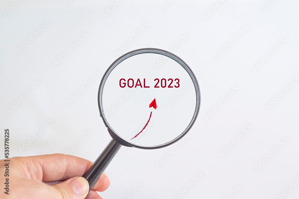 Paper airplane flying to 2023 hefe in magnifying glass. business creativity new idea discovery innovation technology. new year new goal idea concept. Paper airplane flying to 2023 hefe in magnifying glass. business creativity new idea discovery innovation technology. new year new goal idea concept.