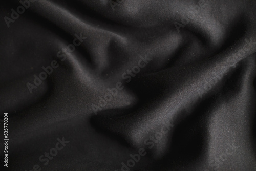 black wrinkled plush fabric background texture, soft material pattern