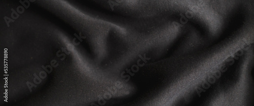 black wrinkled plush fabric background texture, soft material pattern. banner
