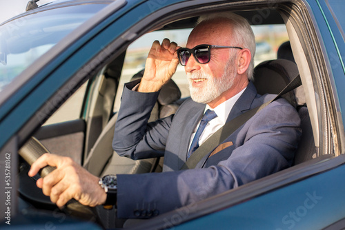 Senior businessman driving car and stuck in traffic jam © Solid photos