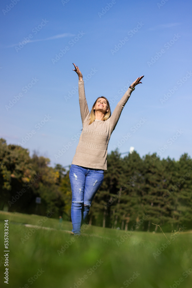Young woman in sunny autumn forest Young woman in sunny autumn forest