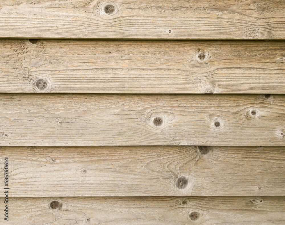 Obraz premium Plank wall background, wooden horizontal layered exterior planks with light wood grain texture