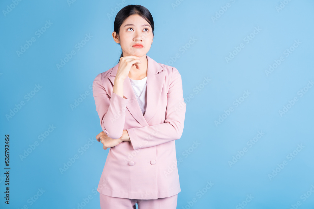 Portrait of young Asian woman posing on background Portrait of young Asian woman posing on background