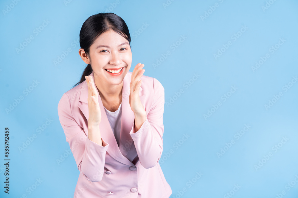 Portrait of young Asian woman posing on background Portrait of young Asian woman posing on background