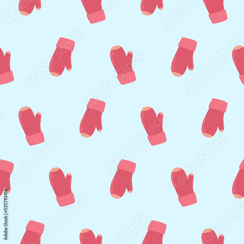 Pattern of pink mittens. Knitted warm mittens on a pattern for textiles, wallpapers, backgrounds.