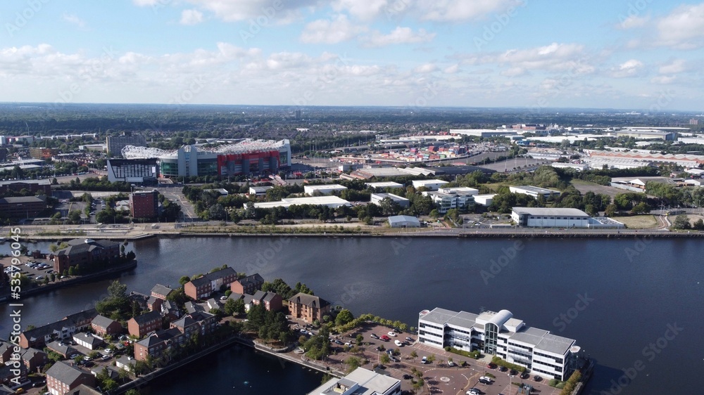 Aerial view of buildings and landmarks in and around Salford Quays in England. 