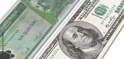 Guatemalan quetzal and US 100 bill. Close up Guatemalan banknotes and US banknotes