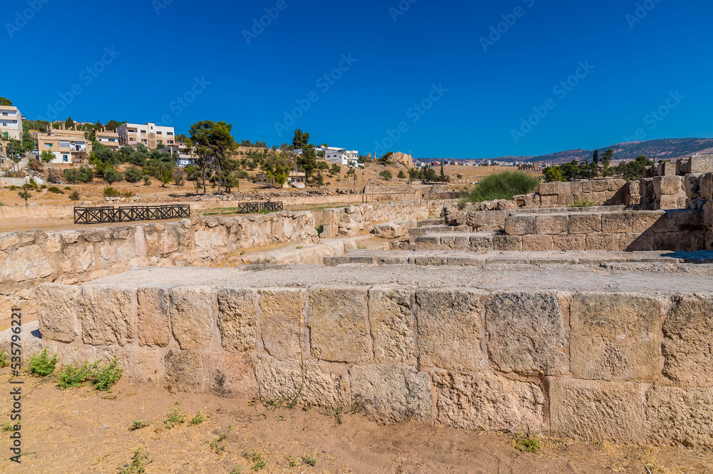 A view along the side of the Hippodrome in the ancient Roman settlement of Gerasa in Jerash, Jordan in summertime