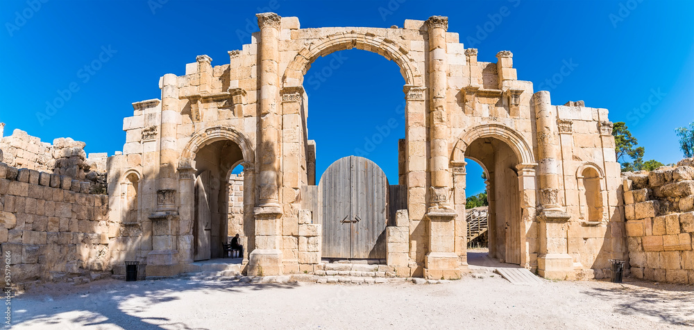 A view towards an archway in the ancient Roman settlement of Gerasa in Jerash, Jordan in summertime