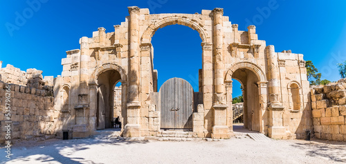 A view towards an archway in the ancient Roman settlement of Gerasa in Jerash, Jordan in summertime photo