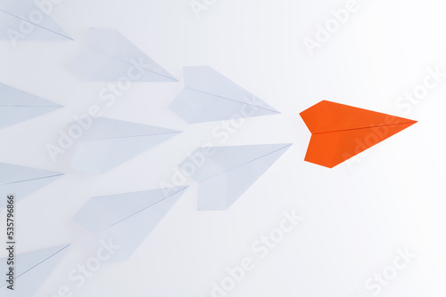 The orange origami plane is leader