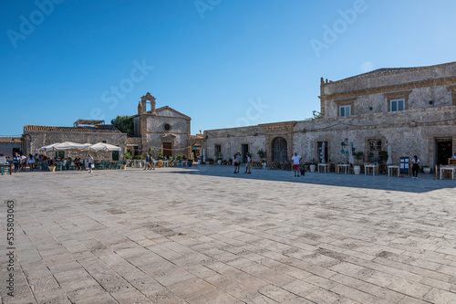 Piazza Regina Margherita in Marzamemi full of colors and characteristic places