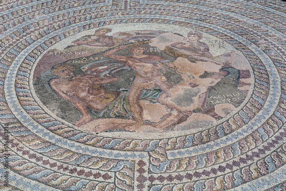 old mosaic in paphos, cyprus with an antique roman ruin