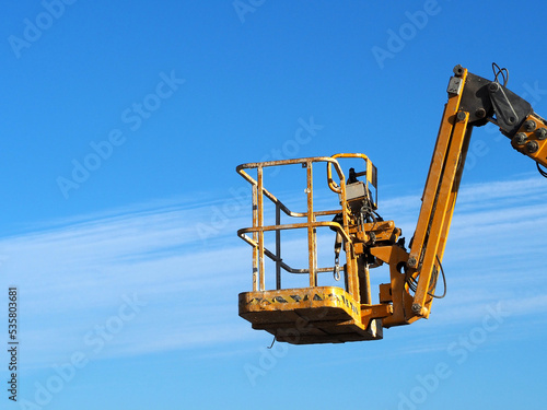Wallpaper Mural Industrial boom lift reaching high up Torontodigital.ca