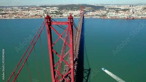 Aerial drone view. Flying around the bridge. Portugal Lisbon. Ponte 25 de abril. Bridge over the ocean