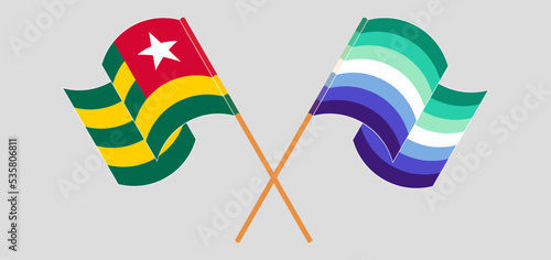 Crossed and waving flags of Togo and gay men pride