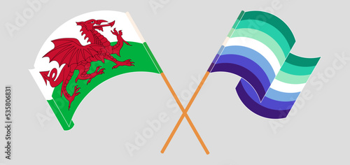 Crossed and waving flags of Wales and gay men pride