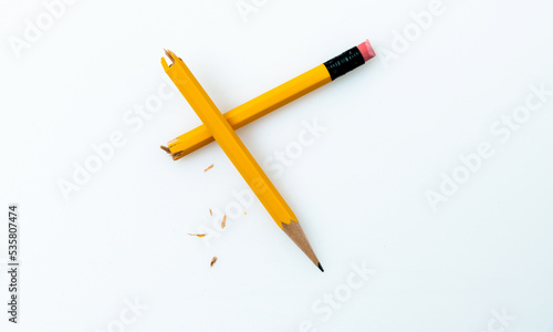 Broken pencil on white background