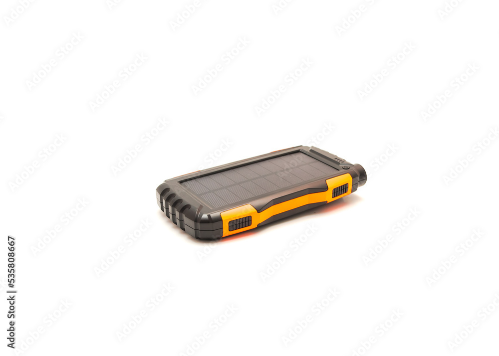 Solar power bank with mini panel isolated and rugged shell to protect it from falls on white background Solar power bank with mini panel isolated and rugged shell to protect it from falls on white background