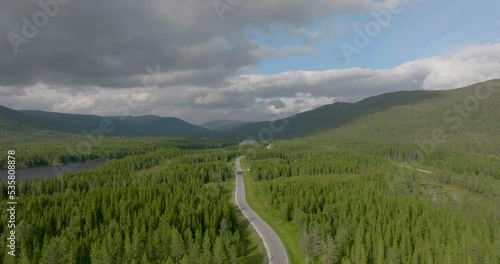 Road E6 - Scenic Highway Surrounded With Coniferous Forests In Norway - aerial drone shot photo