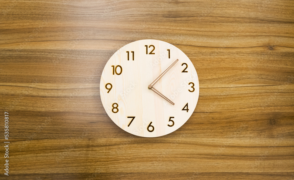 Circle clock on wooden wall Circle clock on wooden wall