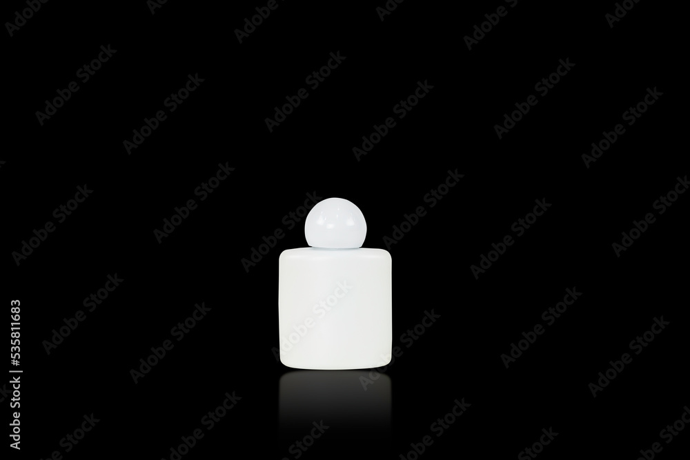 White plastic bottles with contains white material isolated on black background with clipping path. White plastic bottles with contains white material isolated on black background with clipping path.