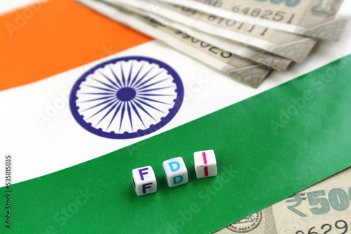 Foreign Direct Investment in India. The abbreviation FDI on the background of the Indian flag.