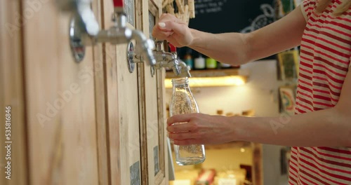 woman,at home,cost of living,energy,electricity,gas,crisis,cold,heating,fuel poverty,bill,keeping warm,hot water bottle,hugging,holding,wearing,gloves,jumper,warm clothing,saving money,central heating