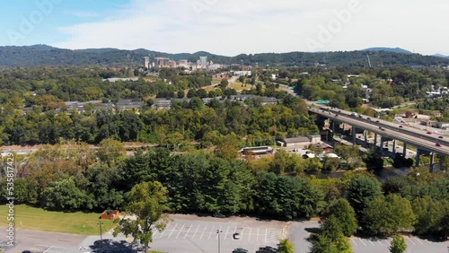 4K Drone Video (truck shot) of French Broad River next to Downtown Asheville, NC on Sunny Summer Day - 06 photo