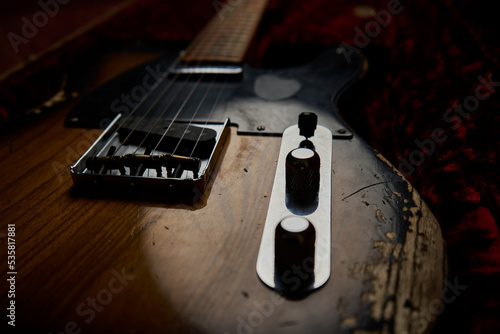 Old guitar with black background