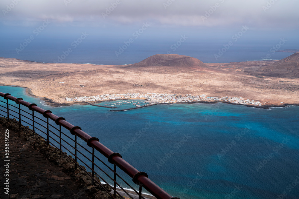 Obraz premium View of the small town on the island of La Graciosa, from a viewpoint. Photography made in Lanzarote, Canary Islands, Spain.